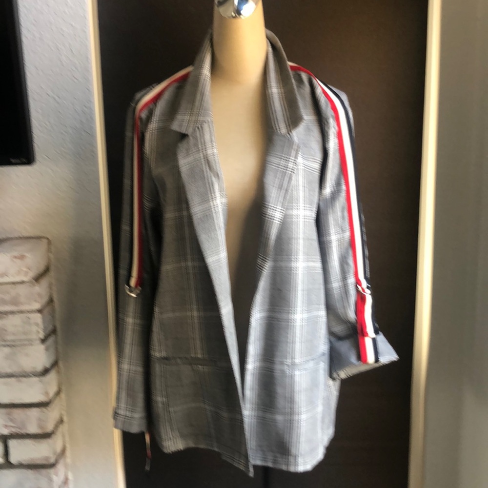 Plaid blazer with red white and blue strips.